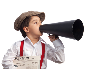 little boy holding newspaper and megaphone